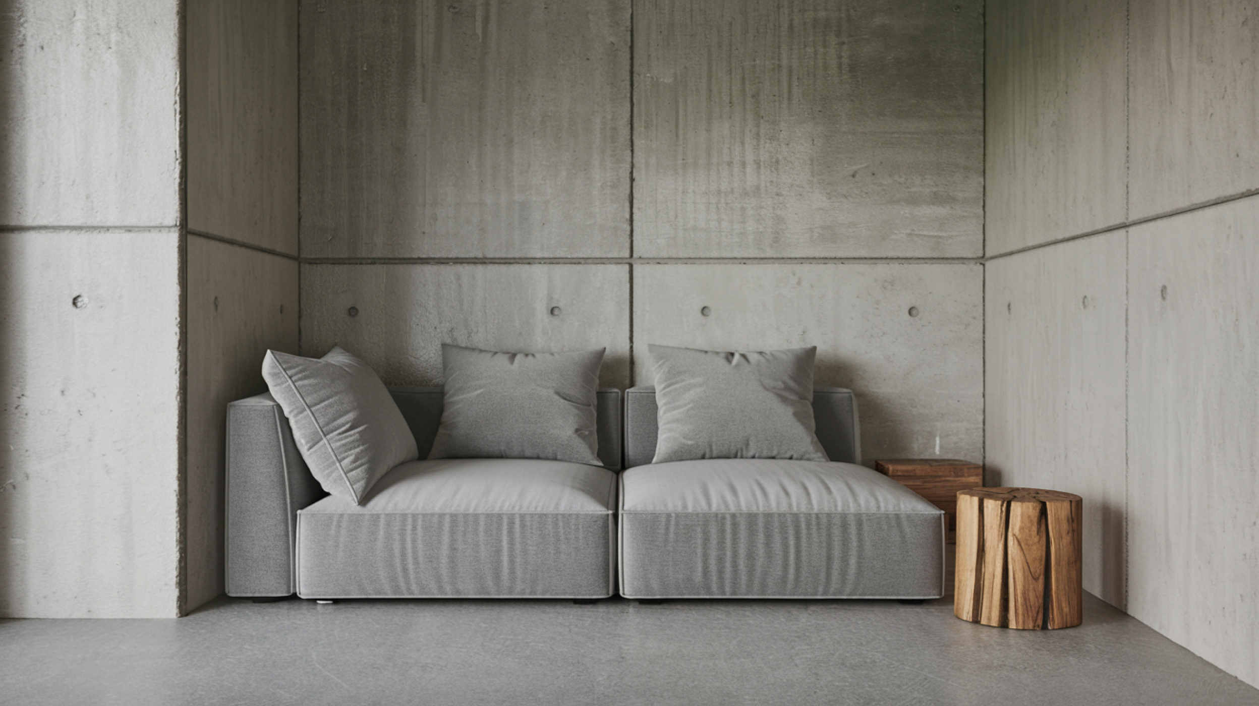 Gray sofa against concrete wall