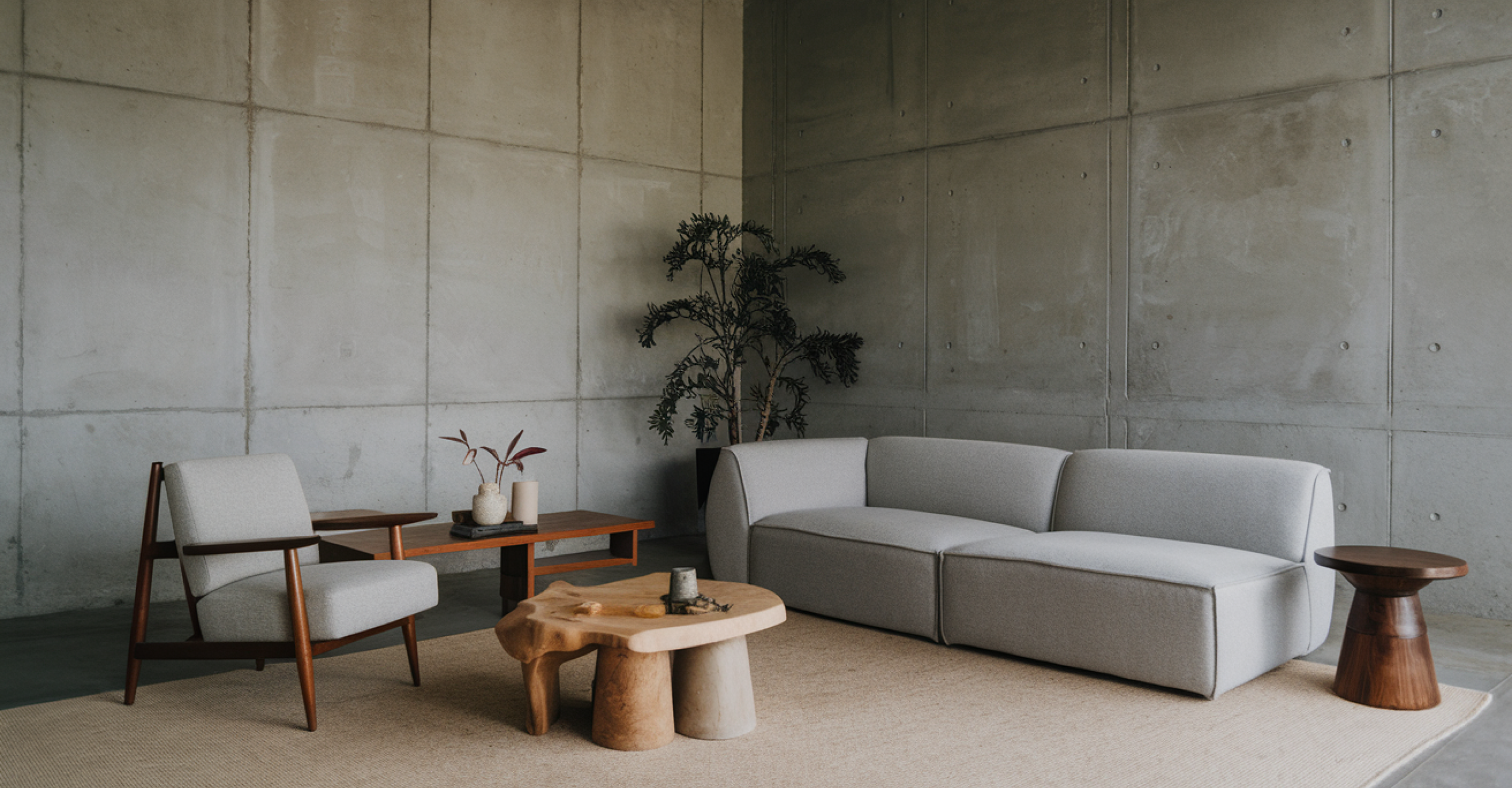 Living room with gray armchair and two-seater sofa