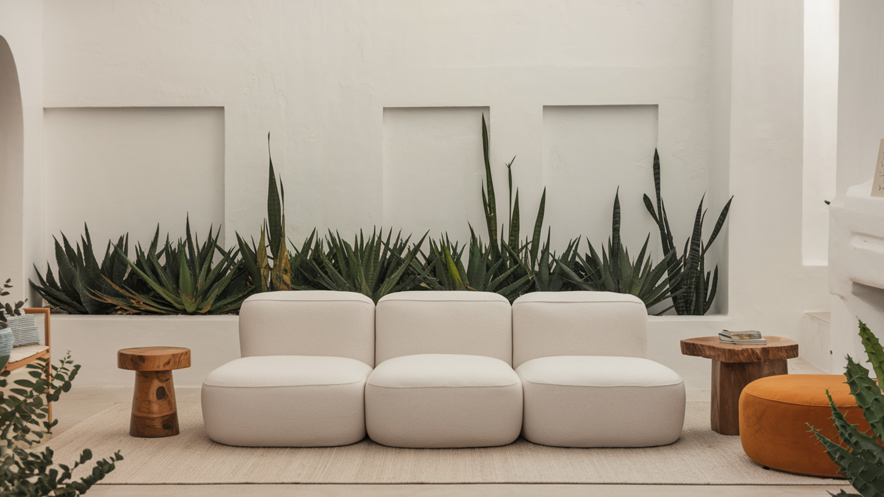 Living room with gray three-seater puffy sofa